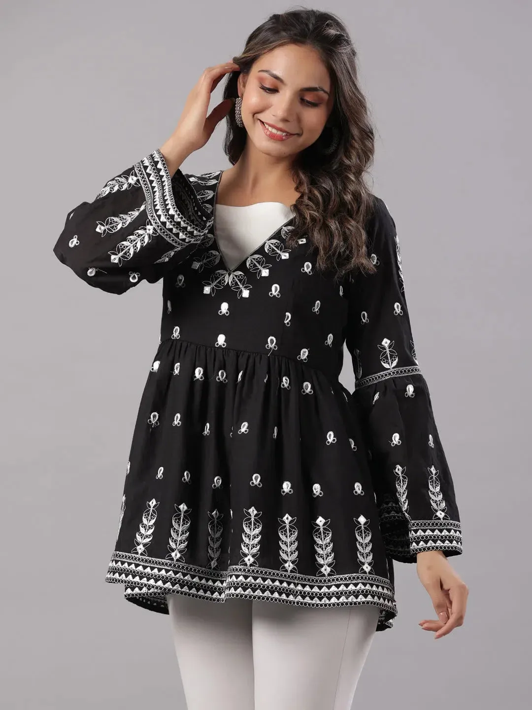 Women Black Cotton Dobby Embroidered Peplum Tunic.