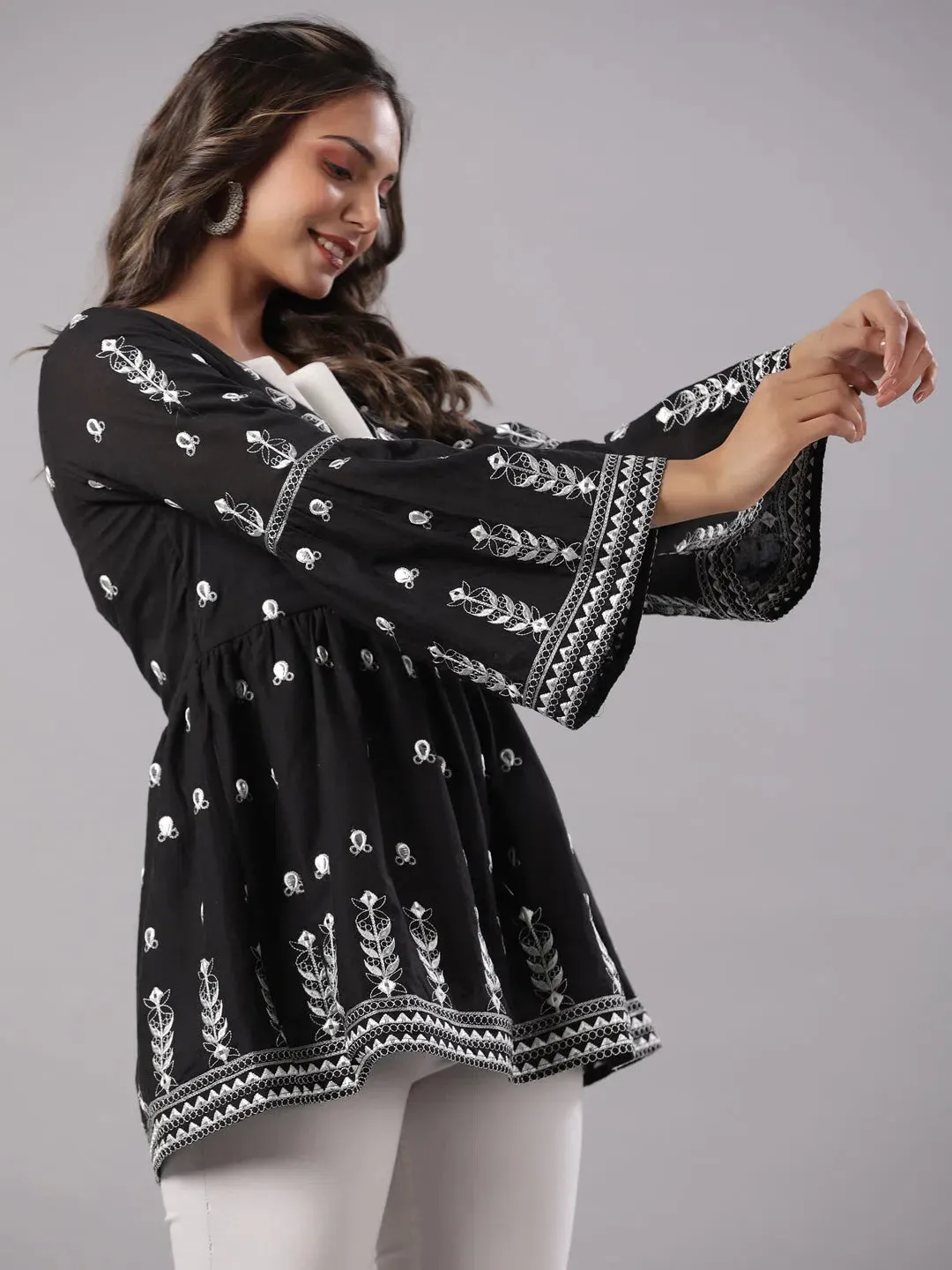 Women Black Cotton Dobby Embroidered Peplum Tunic.